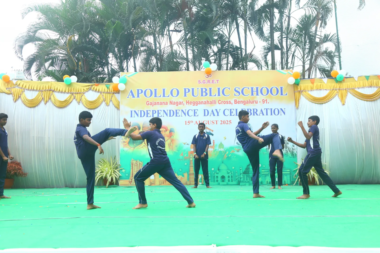 Students performing a martial arts demonstration on the school stage