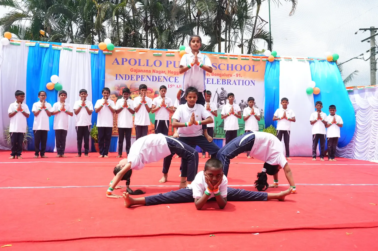 Students performing an acrobatic formation on the school ground for Independence Day