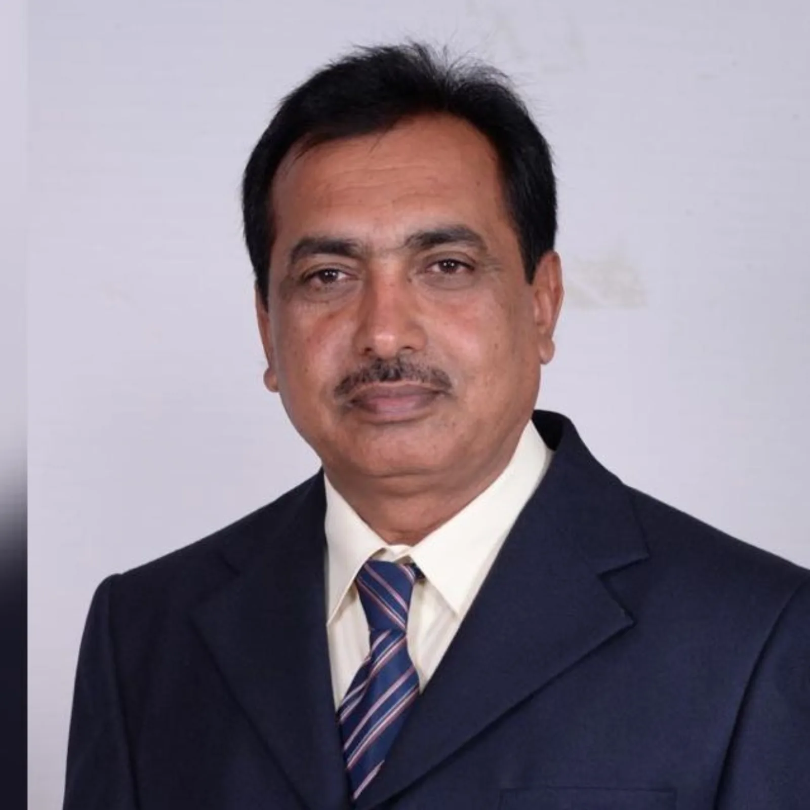 Portrait of Mr. T. C. Nagaraj, Chairman of Apollo Public School